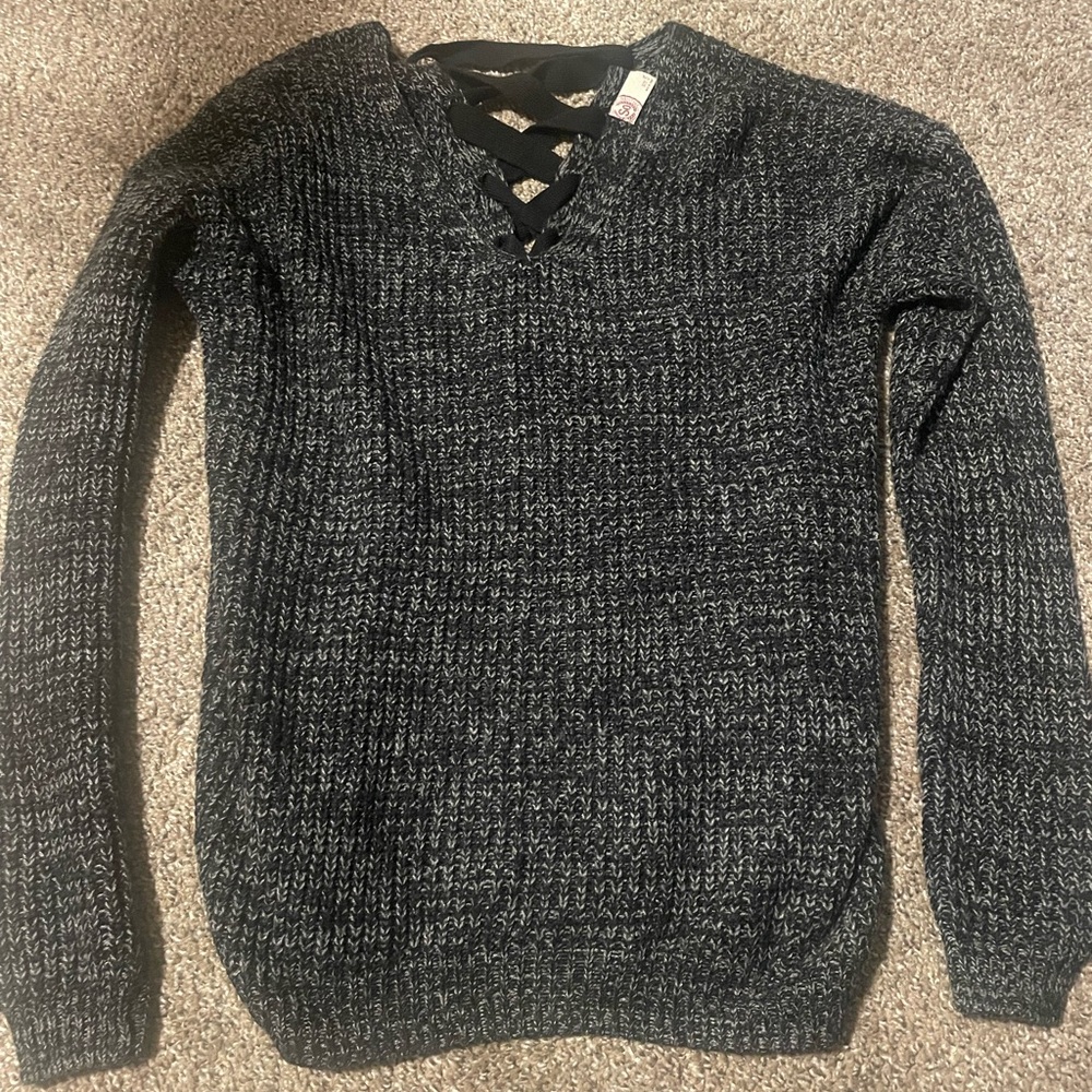 Small black SO sweater with cross-stitch back